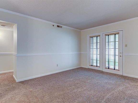 Living room with the French doors going out to the covered patio.