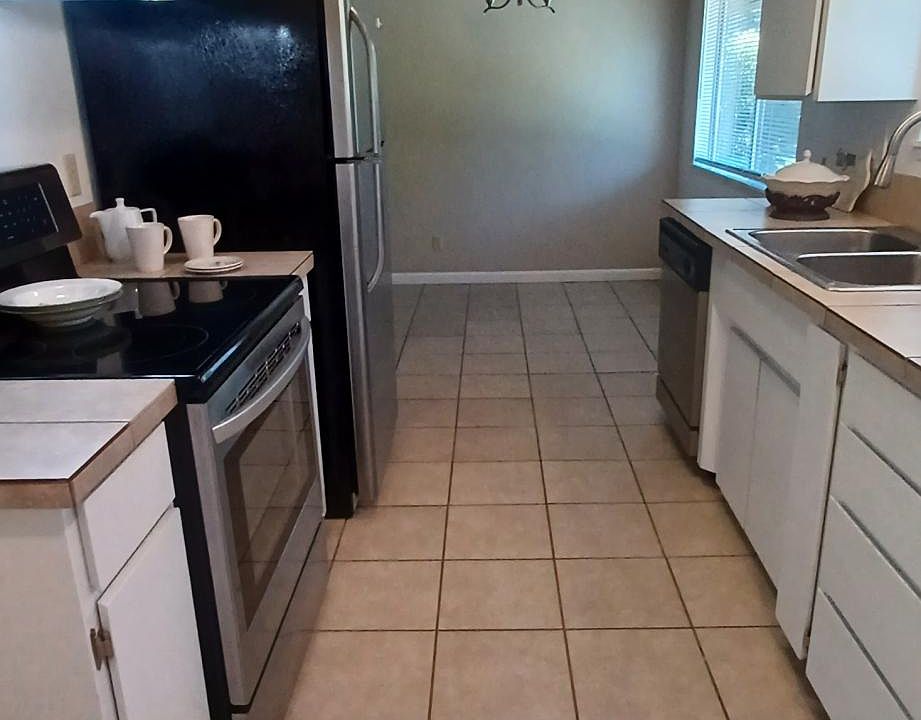 Kitchen to dining view of galley kitchen