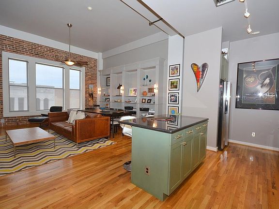 Gleaming oak hardwood floors run throughout this home. The outside wall has exposed brick, and three