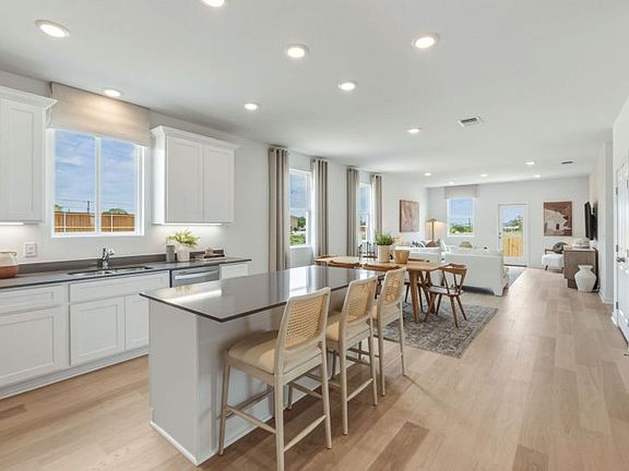 Kitchen Open to the Dining Area and Gathering Space