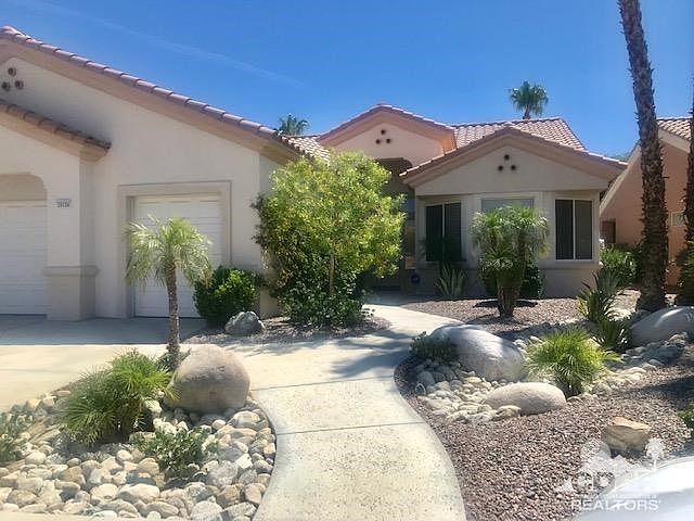 Lovely curb appeal with 2 car garage plus golf cart!