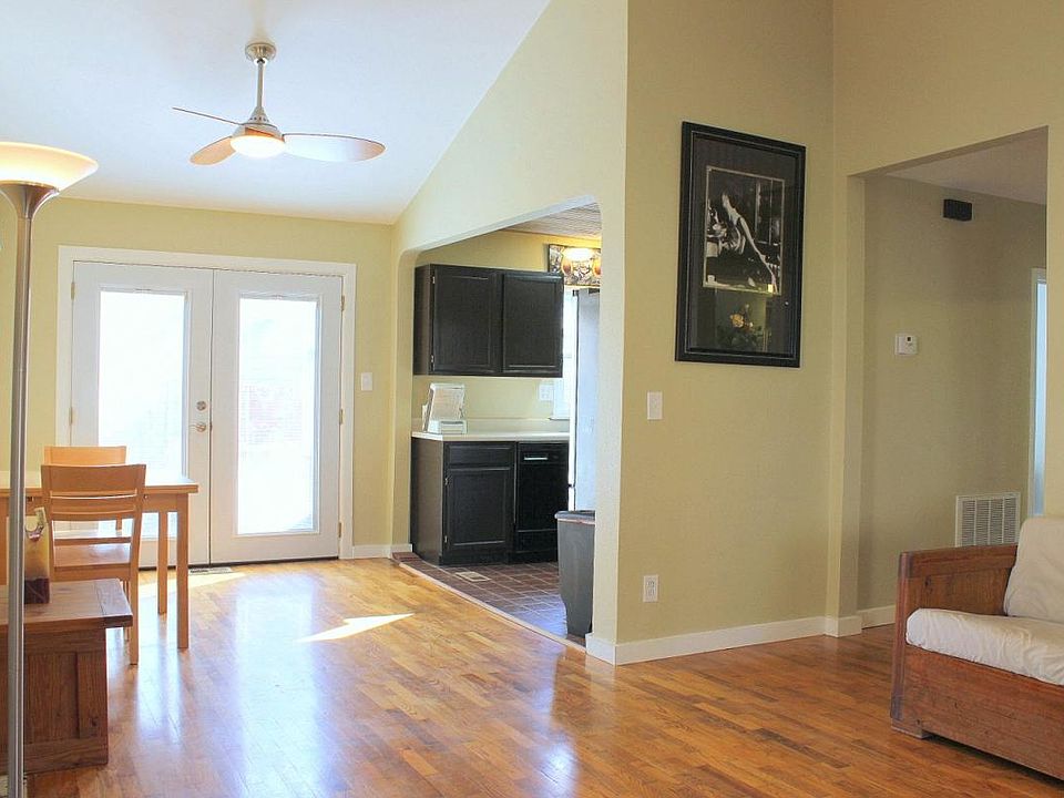 French doors with dustless blinds lead to the side deck.