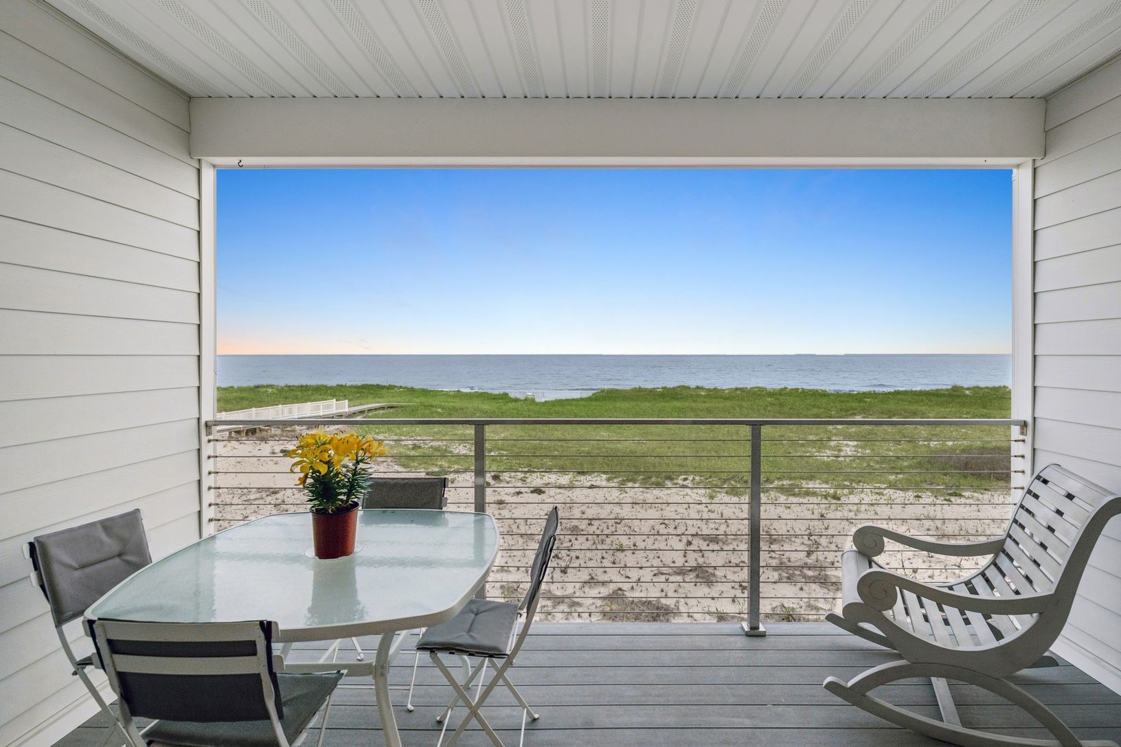 Private covered deck with unobstructed beach and ocean views.