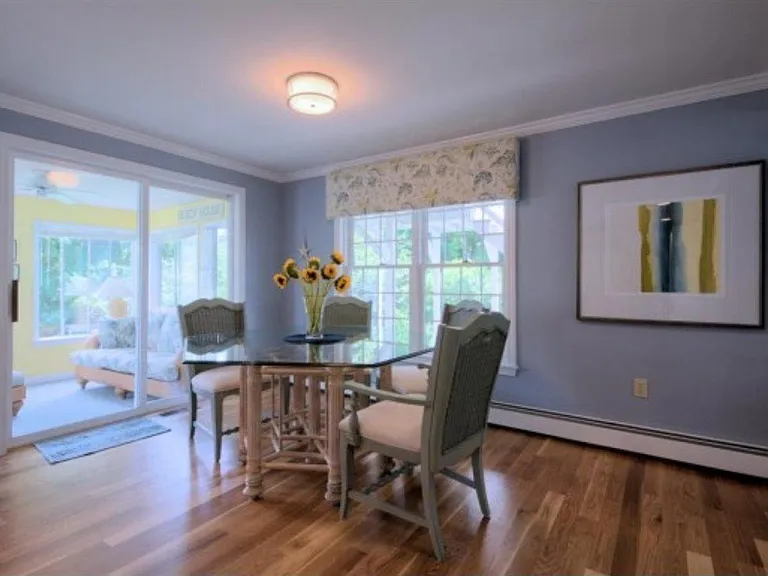 Large glass round table with comfortable chairs for dining