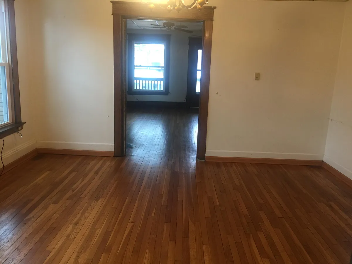 Dining room looking into living room - 633 W 8th St #2