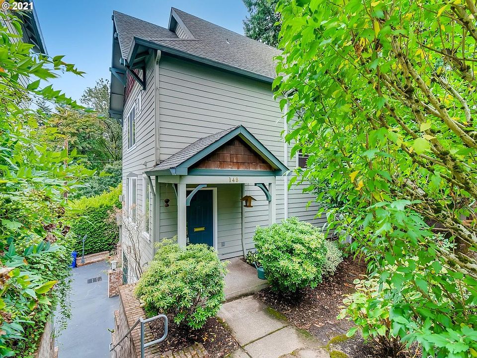 Lots of green in front of the townhome.