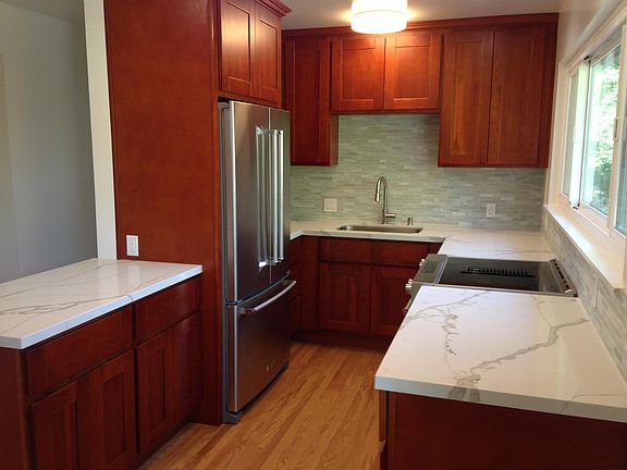 Remodel kitchen with quartz countertops and stainless steel appliances