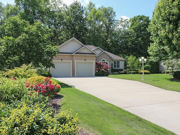 Enjoy the pops of color from the beautiful flowers that surround the home.
