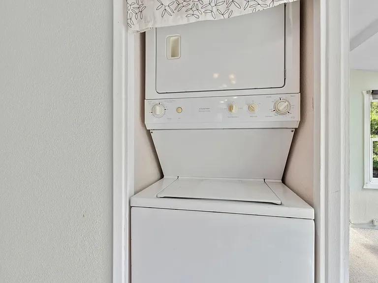 Laundry closet in bedroom