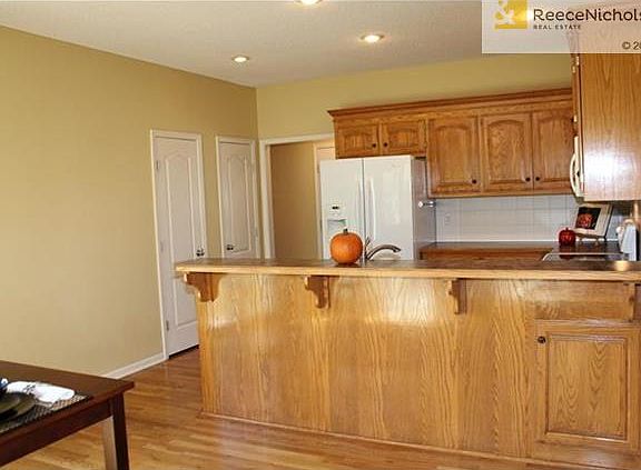 The kitchen has a large counter top for bar seating and two pantries.