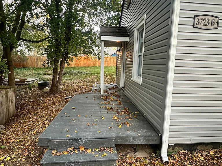 Side door to house walks into kitchen area