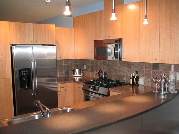 Gourmet kitchen with stainless appliances and granite counters