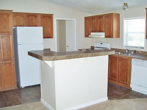 2nd image of 4211 E 100th Ave Lot 448