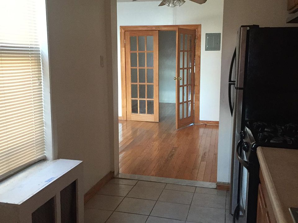 Kitchen looking into living room and 1st bedroom