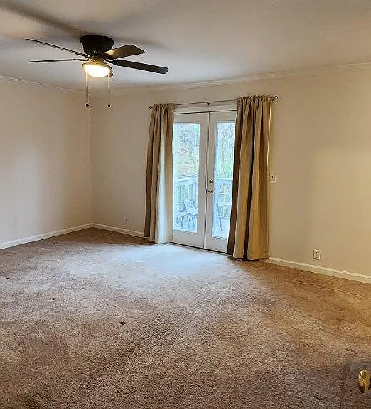 Main Bedroom has a back porch with a view of the back yard