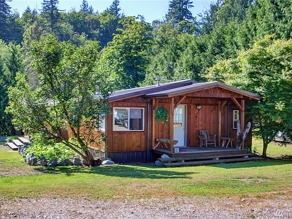 Side entrance with covered patio. 
