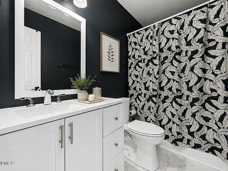 Master bathroom with bathtub.