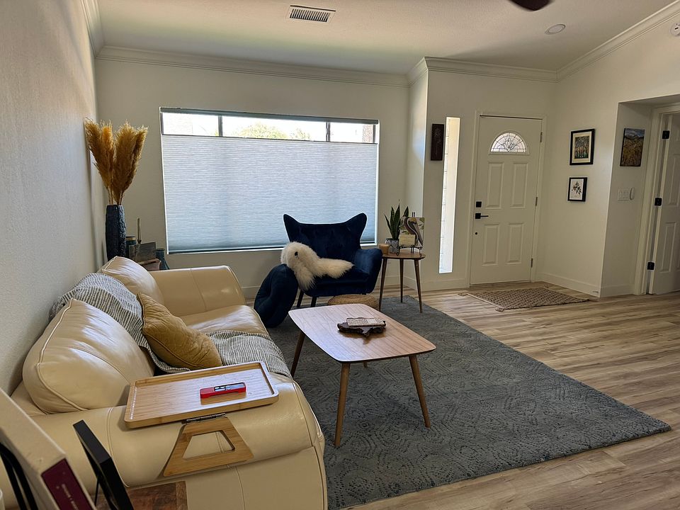 Front room and front door. Large open space for families and a dog or two!