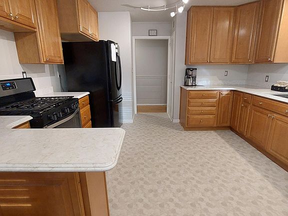 Updated Kitchen Quartz countertops and Gas Stove