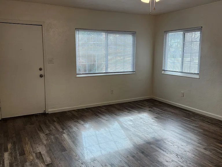 View of living room and front door from dining room