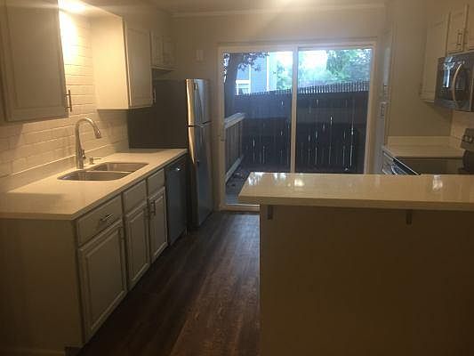 Kitchen looking out at private back deck/yard