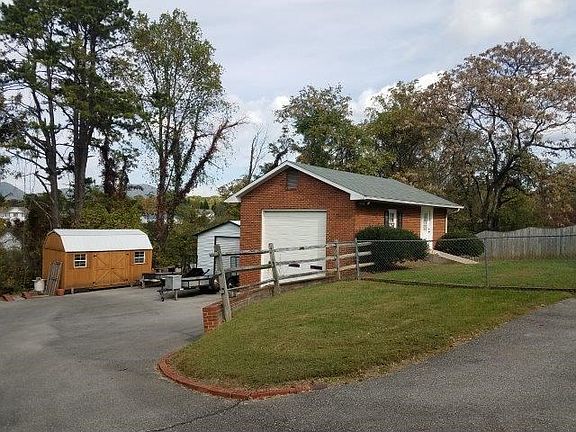 Rear view w/ det. garage