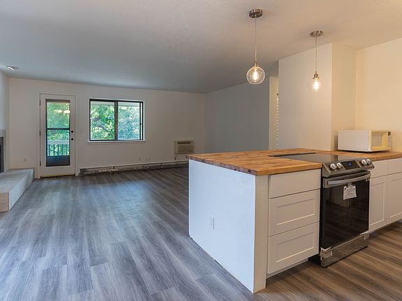 The kitchen is open to the living room with direct access to the deck