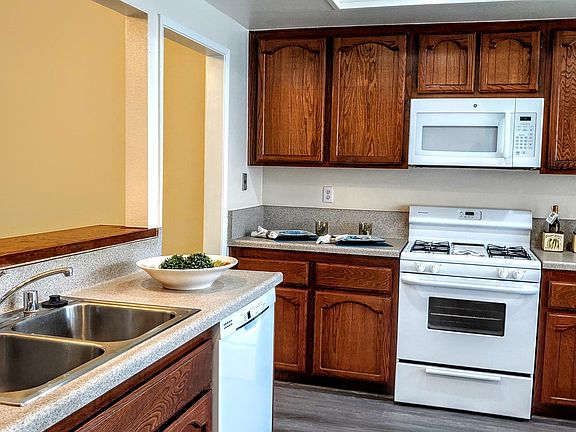 A comfortable kitchen with Nook. Laminate counters, stainless steel sinks, beautiful rich cabinets and Pantry.Gas cooking, new dishwasher and new microwave