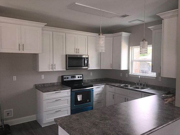 View from living room to kitchen (photo from an identical house we built)