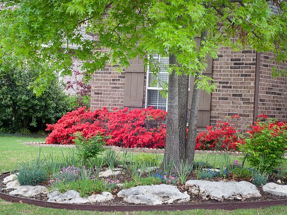 Extensive landscaping surrounds home