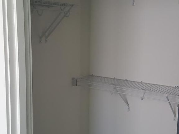 Upper level master bedroom walk-in closet