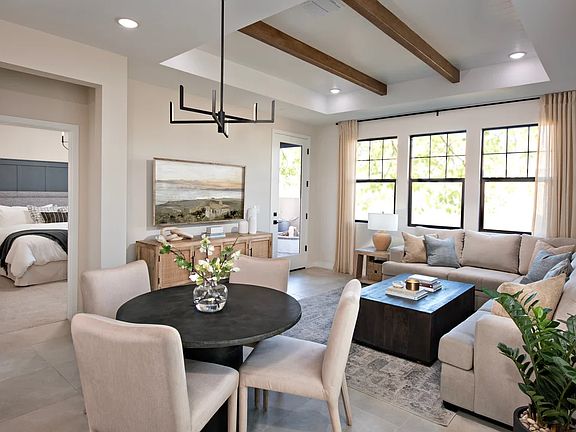 Dining area with stained ceiling beams