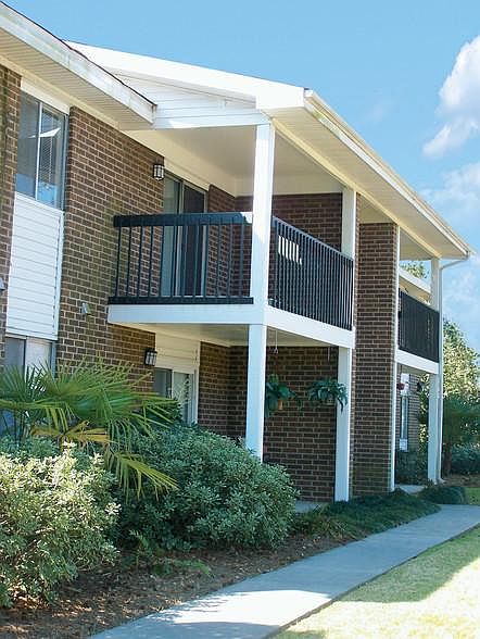 All brick exterior with private patios