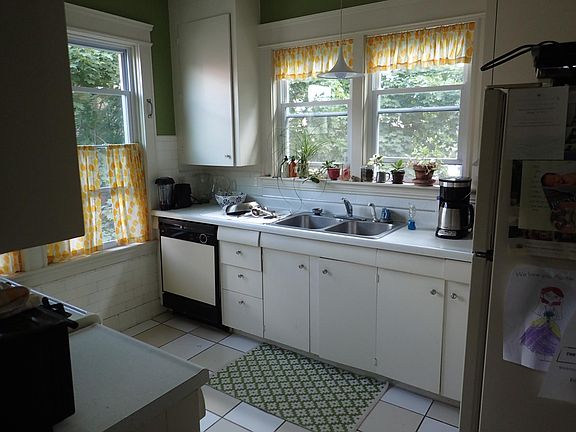 Kitchen. Dishwasher has since been updated. Kitchen now has hardwood floors.