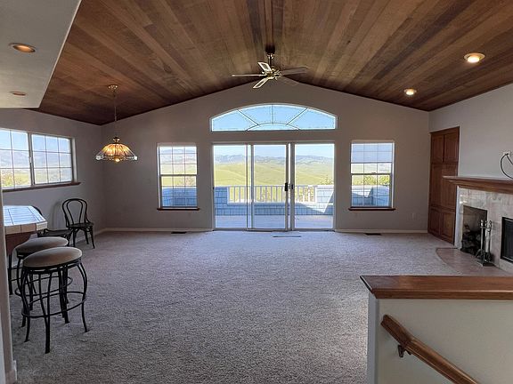 Living room, dining area and kitchen to left