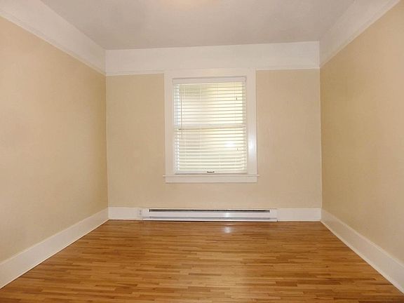 Recently refinished original hardwood floors. Bedroom window is frosted for privacy.