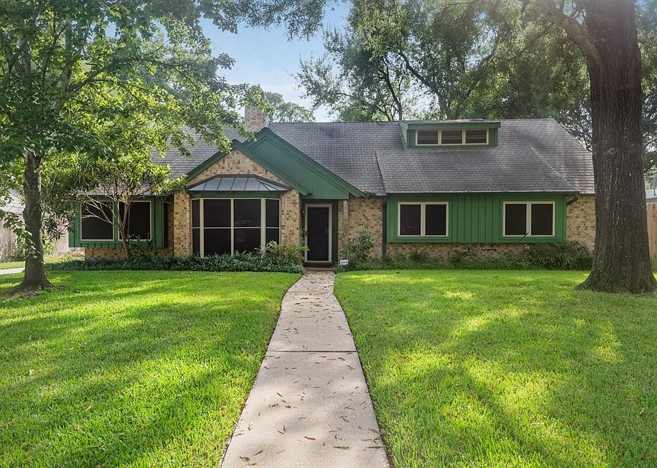 Welcome to a home in an established neighborhood with mature trees.