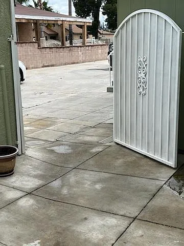 Gate at the back unit entrance provides a secondary security