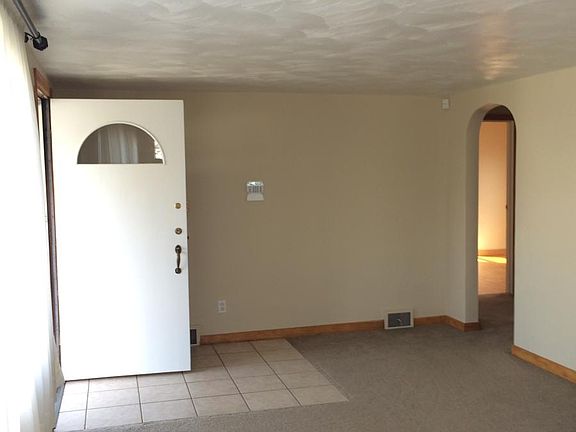 Clean, Modern, Living room area with newer carpet 