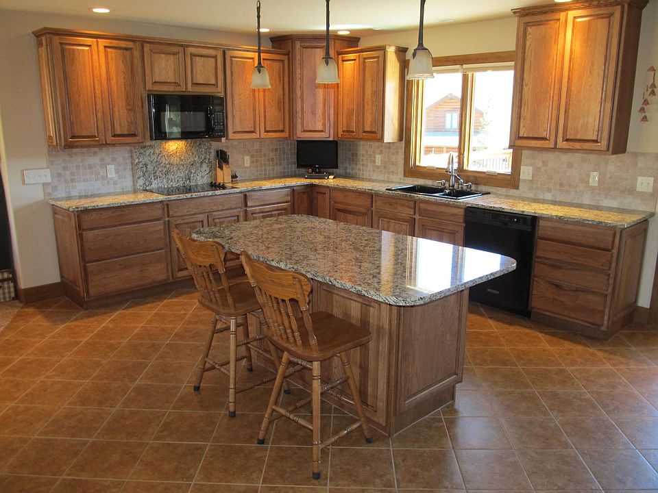 Gourmet kitchen with tile floors