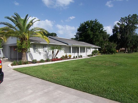 SIDE GARAGE with LOTS of additional parking and PARKING PAD 
