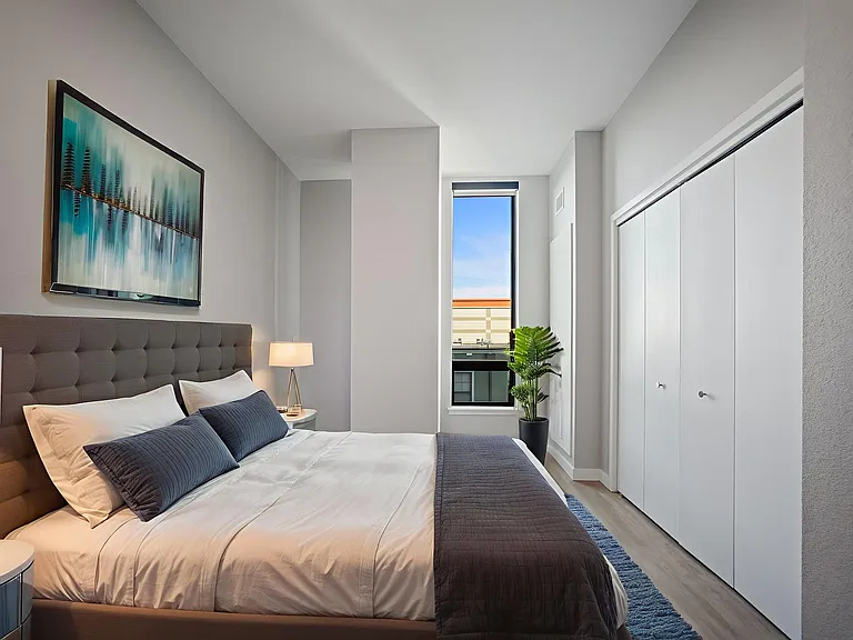 Retreat to a spacious bedroom, designed for ultimate comfort and relaxation.