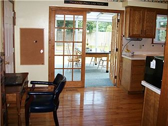 Looking toward Sunroom from Eat In Area of Kitchen