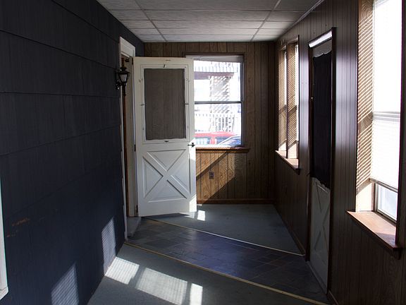 Front Entrance Opens To A Large, Private, Finished Enclosed