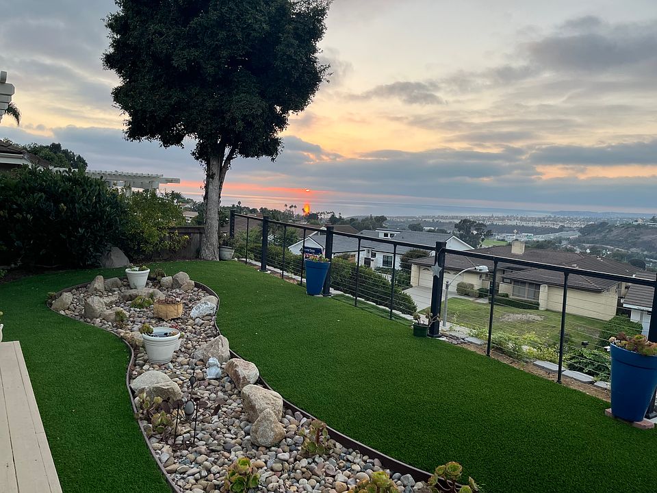 Sunset view from backyard. Low matinence yard with deck