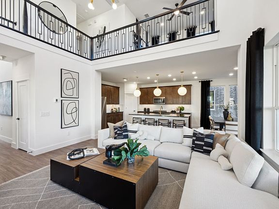 Spacious gathering room with view of kitchen