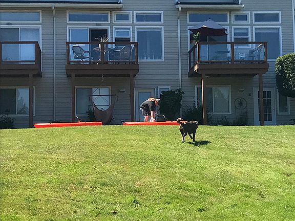 View of the front door from the lake (behind the guy).