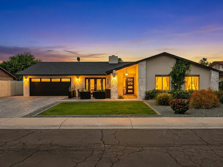 Beautiful fully remodeled home, radiating a warm inviting glow at night time...