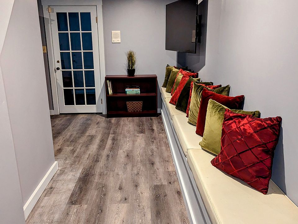 Hallway Leading to Living Room from Kitchen, Large Bedroom and Laundry.