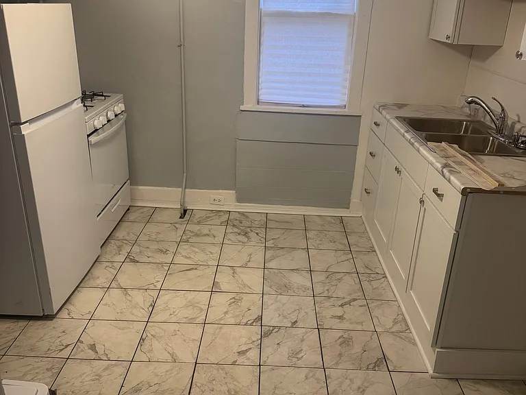 Unit B Kitchen features brand new Stove, refrigerator, microwave, and stove.